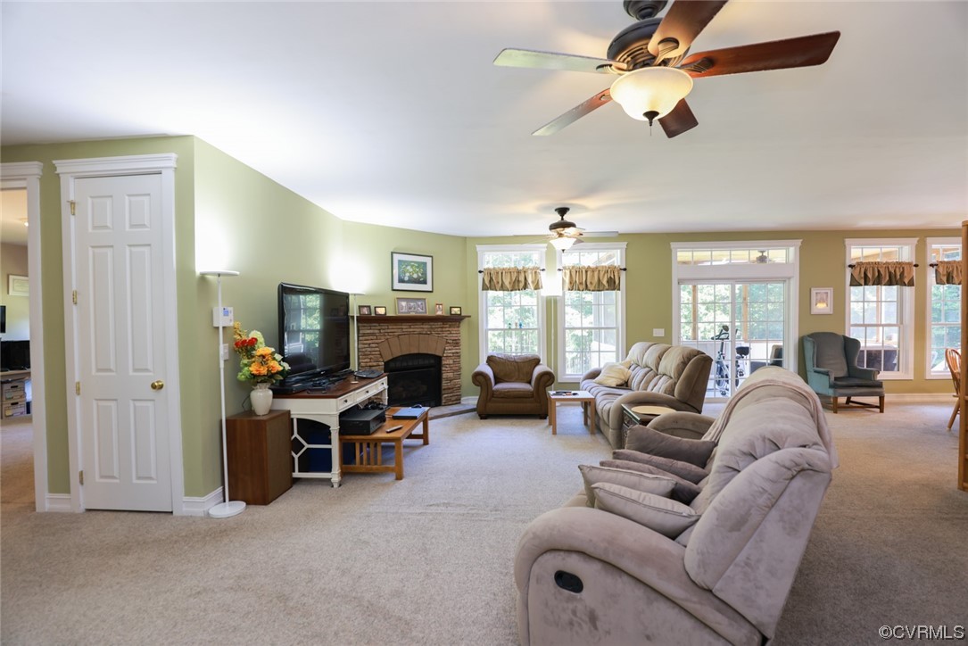 85 Rubermont Road Victoria, VA 23974 - Photo 9 of 49 a living room with furniture a fireplace and a chandelier