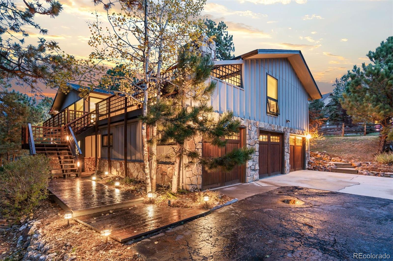 32329 Inverness Drive Evergreen, CO 80439 - Photo 1 of 48 a view of a house with a yard