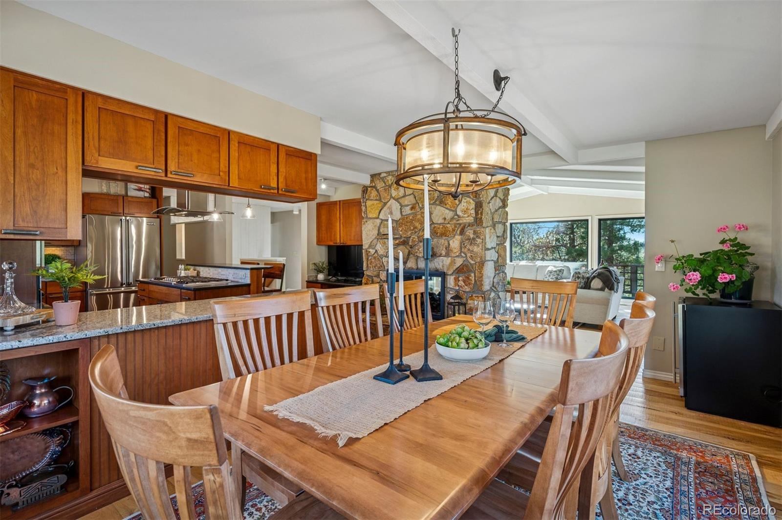 32329 Inverness Drive Evergreen, CO 80439 - Photo 14 of 48 a view of a dining room with furniture window and outside view