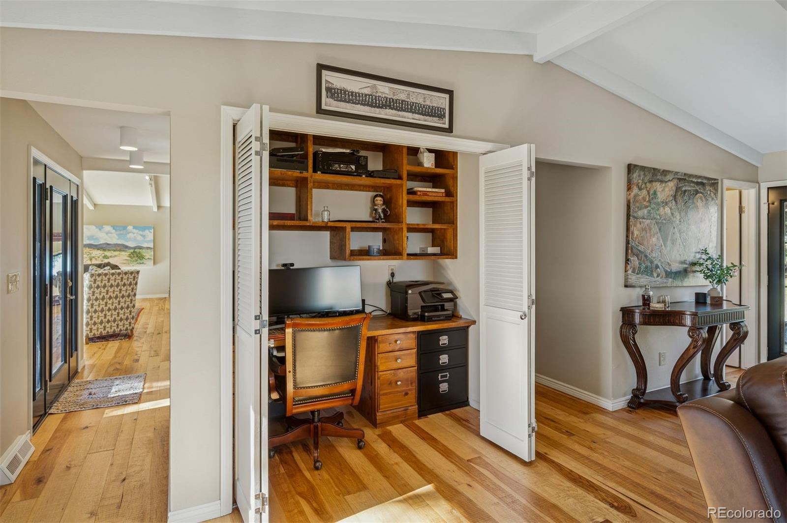 32329 Inverness Drive Evergreen, CO 80439 - Photo 19 of 48 a view of a workspace with furniture and wooden floor