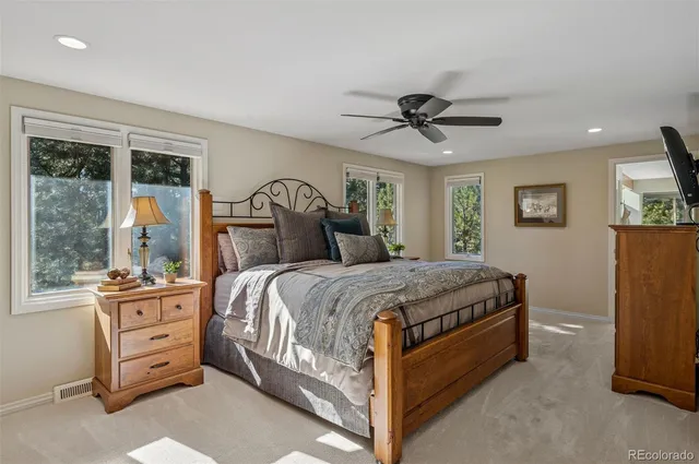 a bedroom with a bed dresser and a window
