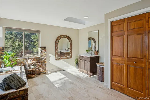 a view of living room filled with furniture and window