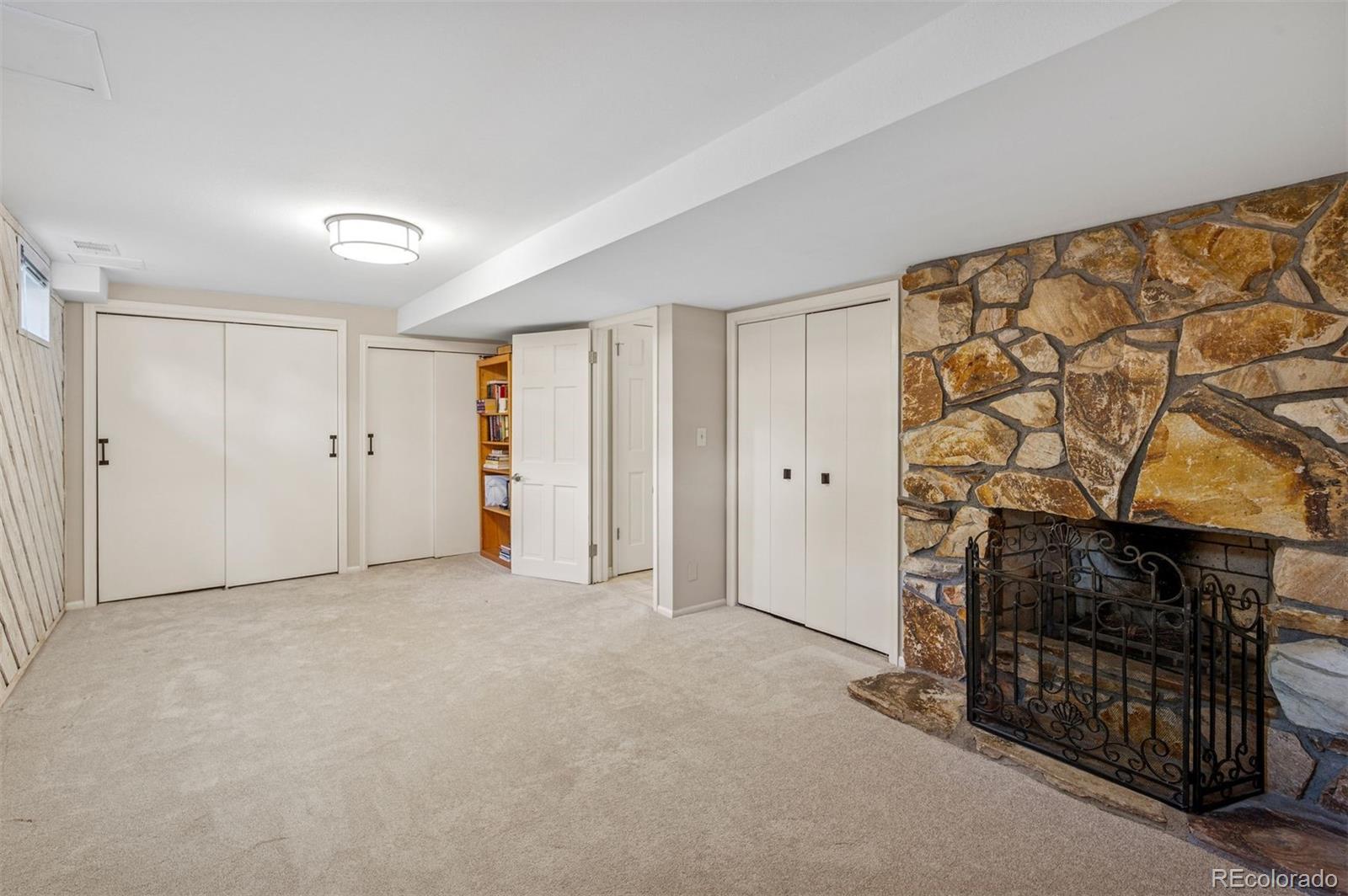 32329 Inverness Drive Evergreen, CO 80439 - Photo 31 of 48 a view of empty room with fireplace