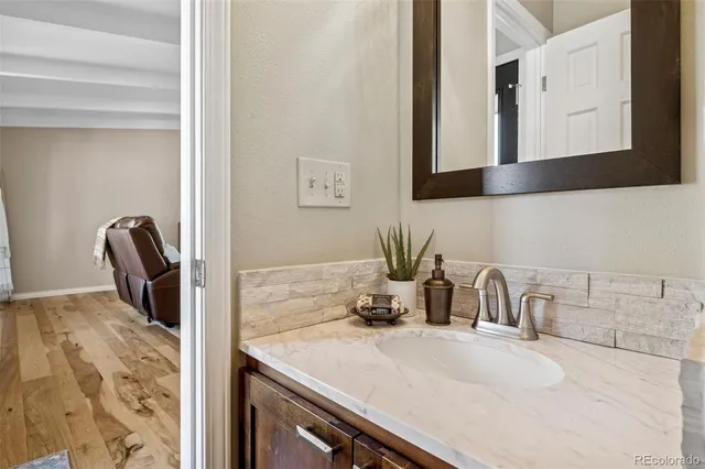 a kitchen with a sink and a refrigerator