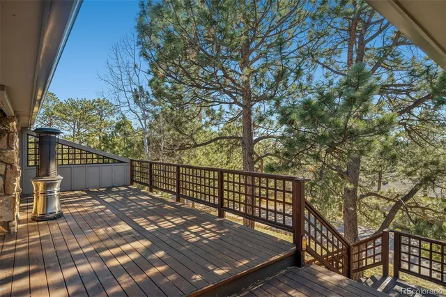 a view of a wooden roof with trees