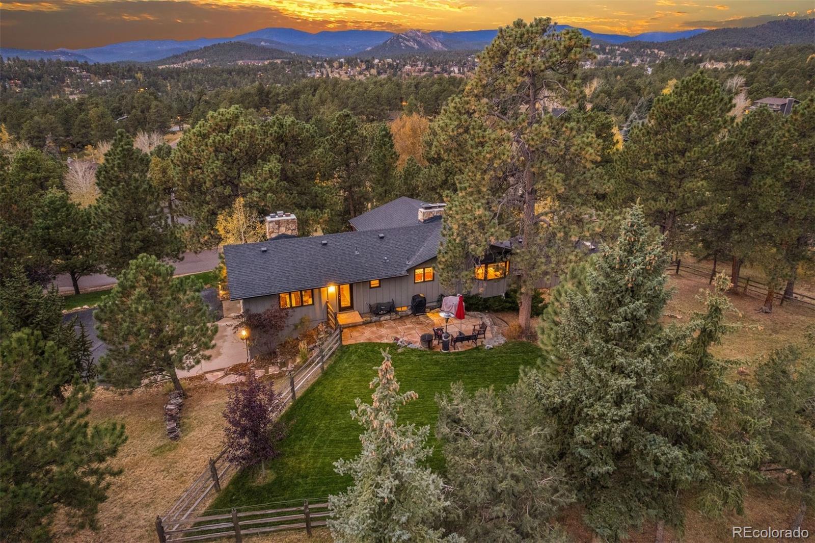 32329 Inverness Drive Evergreen, CO 80439 - Photo 39 of 48 a view of a house with a yard