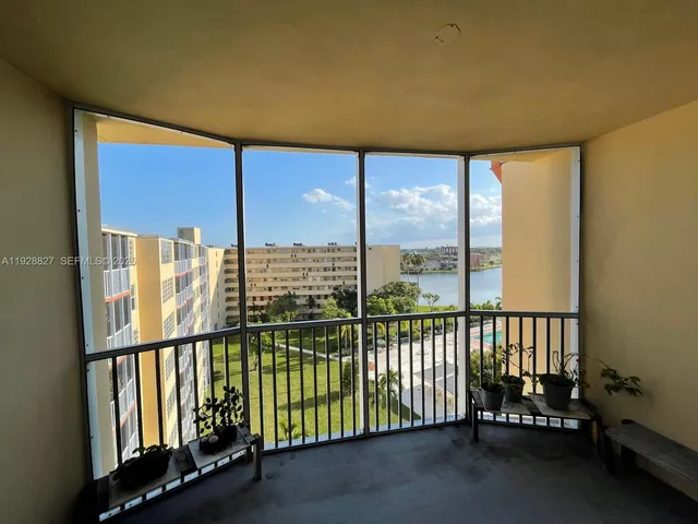 a view of a porch with a floor to ceiling window
