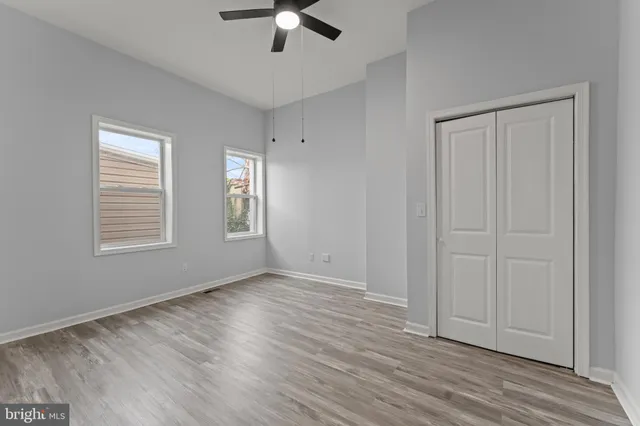 a bathroom with a toilet sink and a mirror