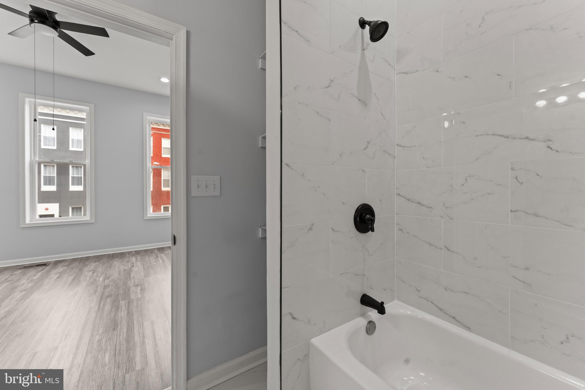 917 Edmondson Avenue Baltimore, MD 21223 - Photo 23 of 27 a bathroom with a tub