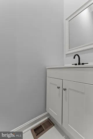 a kitchen with a sink cabinets stainless steel appliances and cabinets