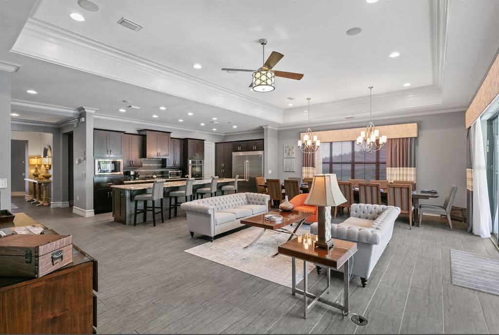 1105 Watson Court Reunion, FL 34747 - Photo 16 of 61 a living room with furniture kitchen view and a large window