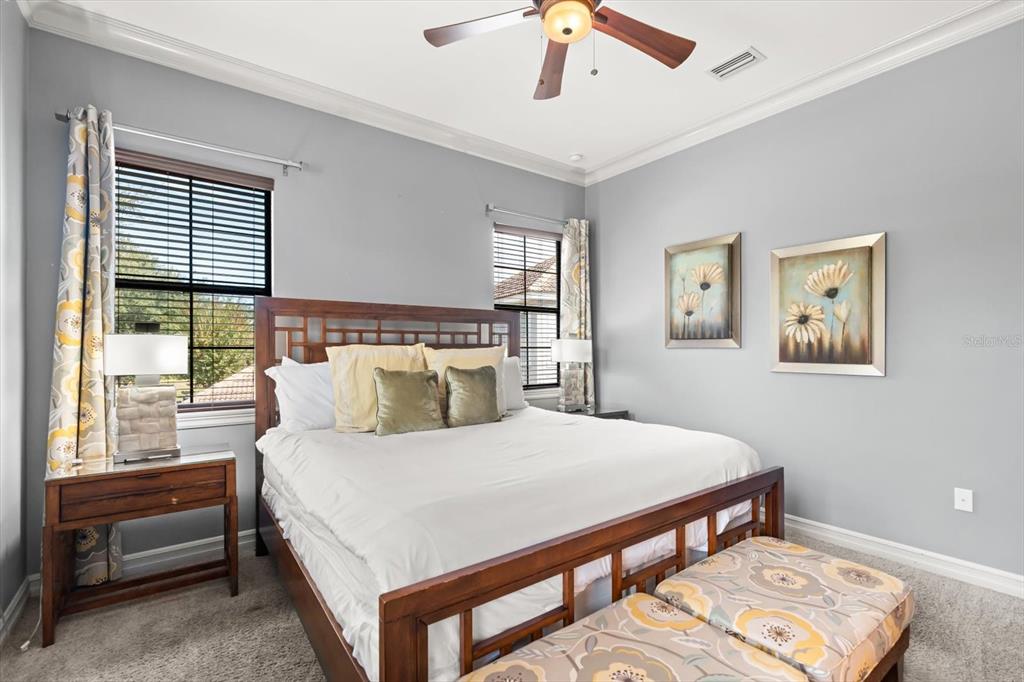 1105 Watson Court Reunion, FL 34747 - Photo 33 of 61 a bedroom with a large bed and a window