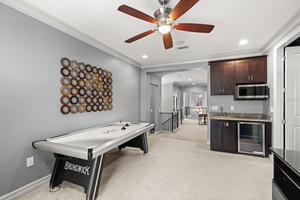 1105 Watson Court Reunion, FL 34747 - Photo 47 of 61 a room with furniture and a kitchen