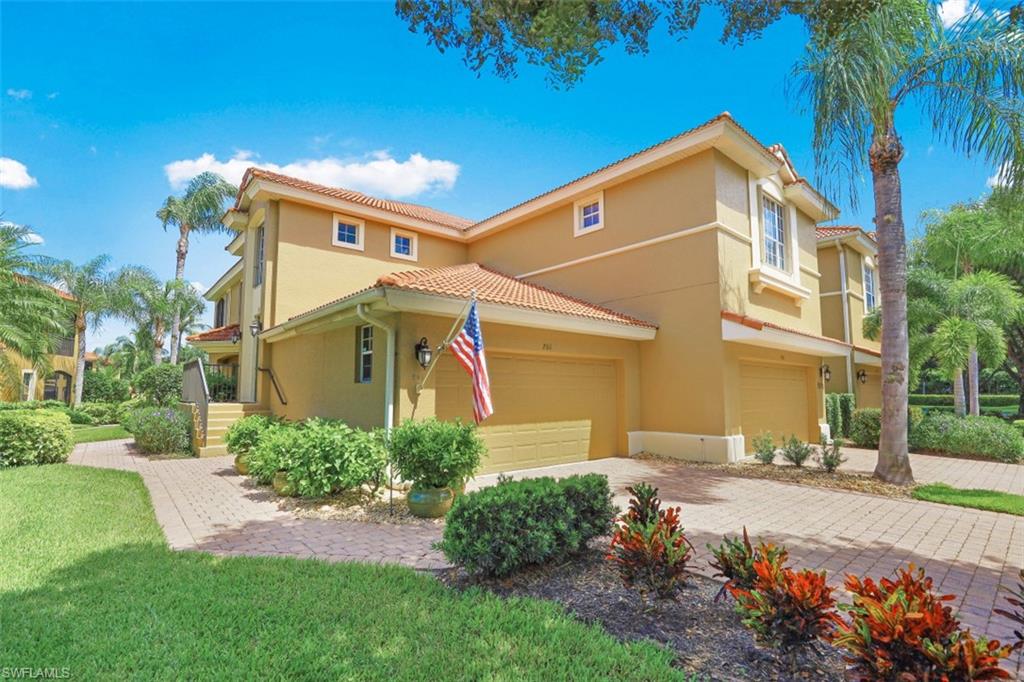 5001 Maxwell Circle, Unit 8201 Naples, FL 34105 - Photo 1 of 1 a front view of a house with a yard