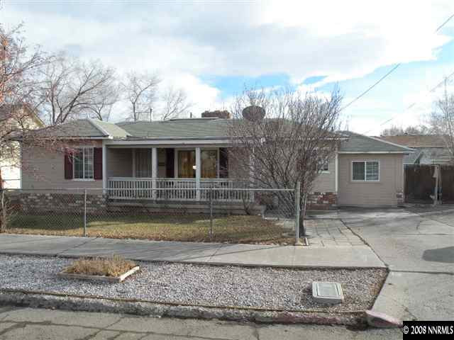 414 Vassar Street Reno, NV 89502 - Photo 1 of 3 a front view of a house with garden