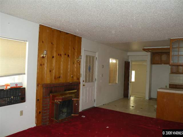 414 Vassar Street Reno, NV 89502 - Photo 3 of 3 a view of a hallway with wooden floor and a bathroom