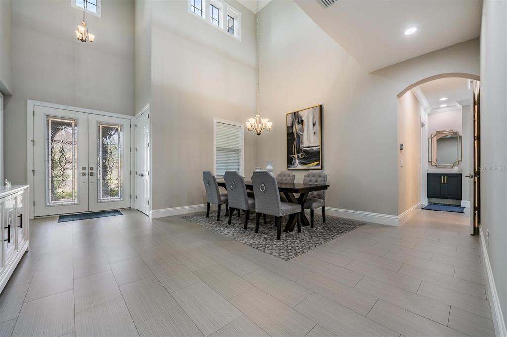 2913 Valencia Ridge Street Valrico, FL 33596 - Photo 11 of 31 a view of a dining room with furniture and chandelier