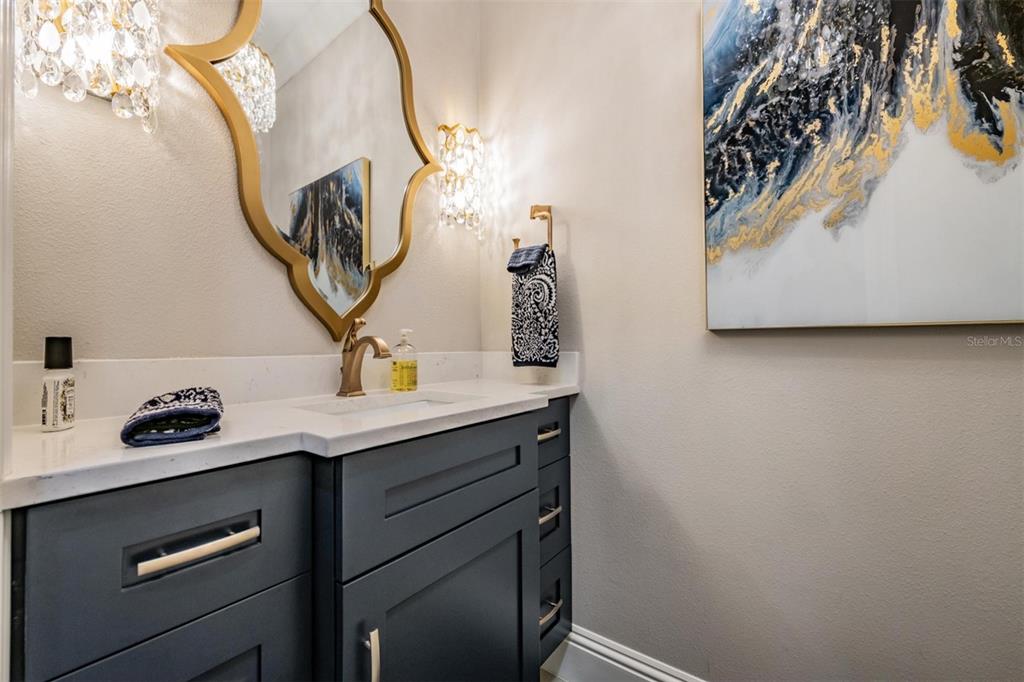 2913 Valencia Ridge Street Valrico, FL 33596 - Photo 12 of 31 a bathroom with a sink and a mirror