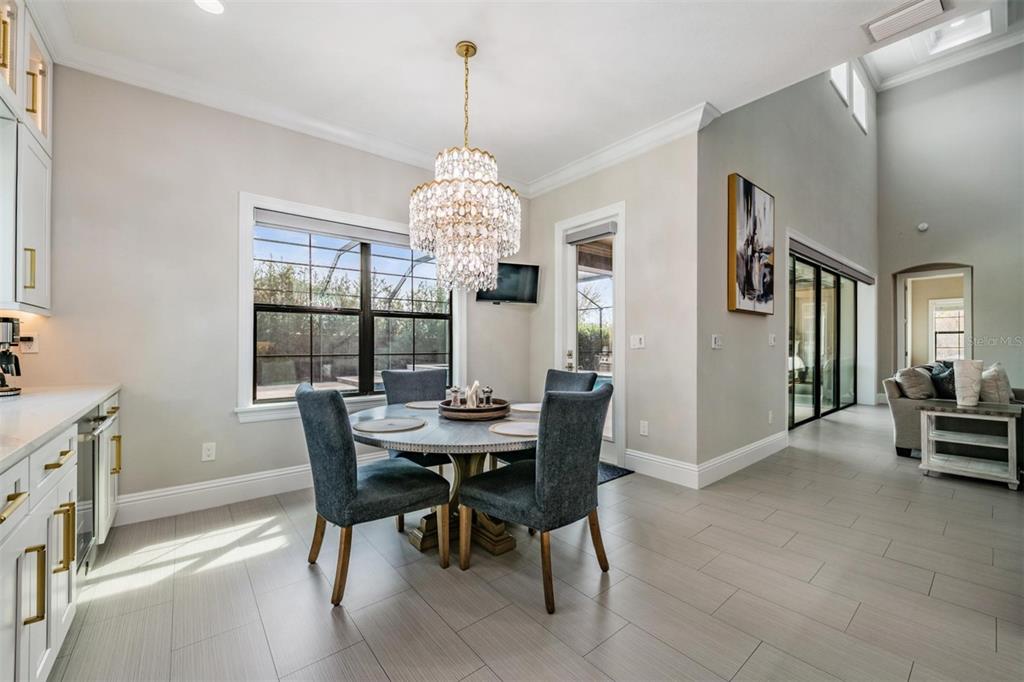 2913 Valencia Ridge Street Valrico, FL 33596 - Photo 16 of 31 a view of a dining room with furniture window and wooden floor