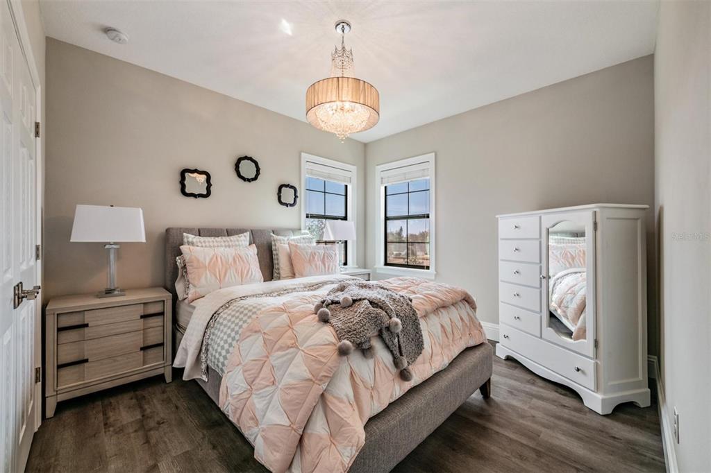 2913 Valencia Ridge Street Valrico, FL 33596 - Photo 20 of 31 a bedroom with a bed and a window