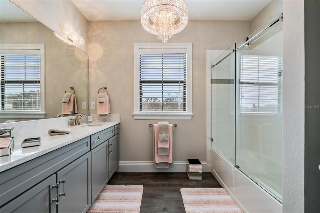 2913 Valencia Ridge Street Valrico, FL 33596 - Photo 21 of 31 a bathroom with double vanity and a mirror