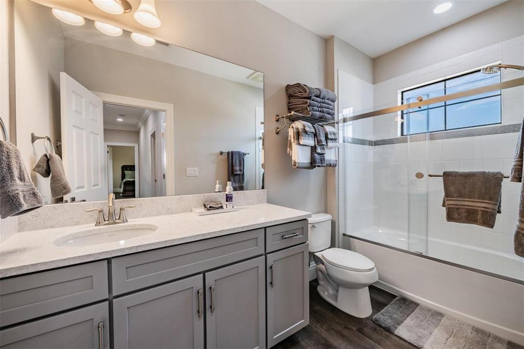 2913 Valencia Ridge Street Valrico, FL 33596 - Photo 24 of 31 a bathroom with a sink toilet and shower