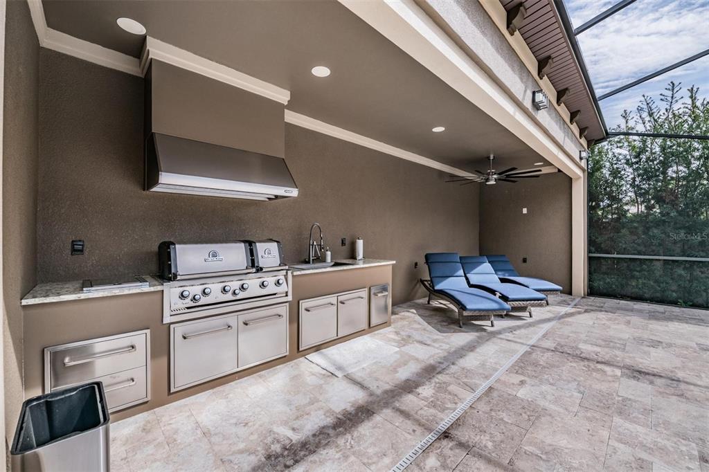 2913 Valencia Ridge Street Valrico, FL 33596 - Photo 28 of 31 a kitchen with a sink appliances and cabinets