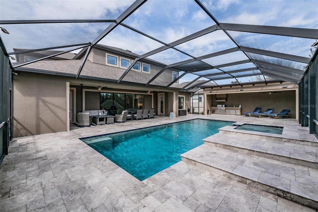 2913 Valencia Ridge Street Valrico, FL 33596 - Photo 30 of 31 a view of a backyard with sitting area