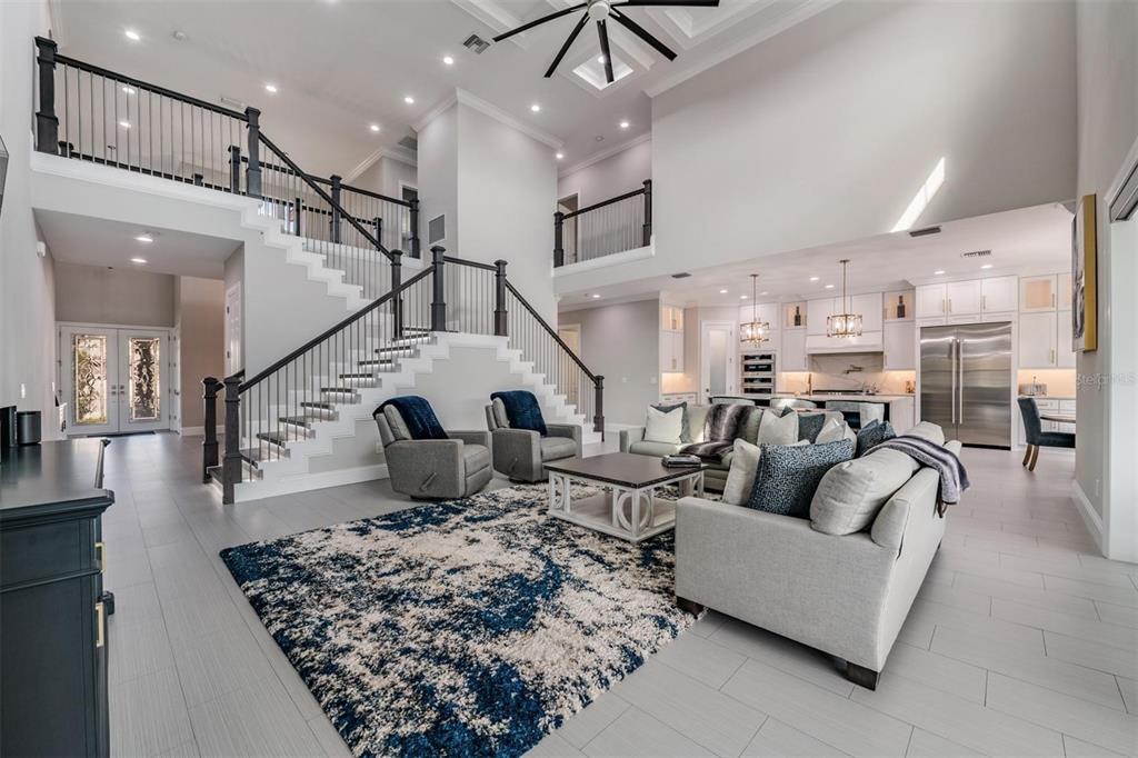 2913 Valencia Ridge Street Valrico, FL 33596 - Photo 4 of 31 a living room with furniture and a chandelier