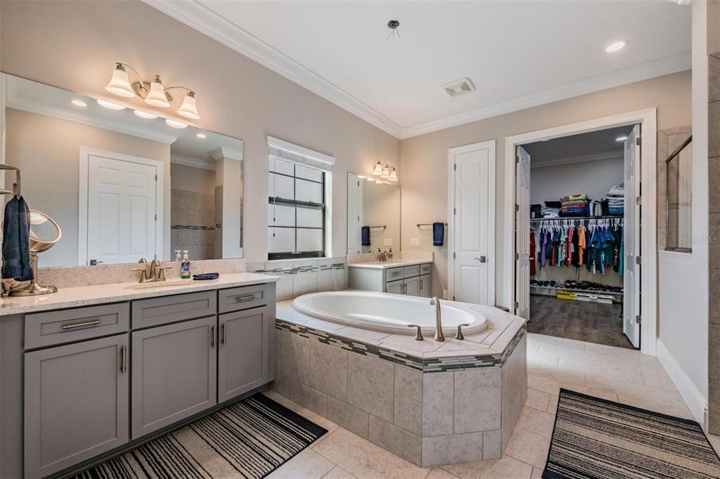 2913 Valencia Ridge Street Valrico, FL 33596 - Photo 7 of 31 a large white kitchen with a large tub and sink