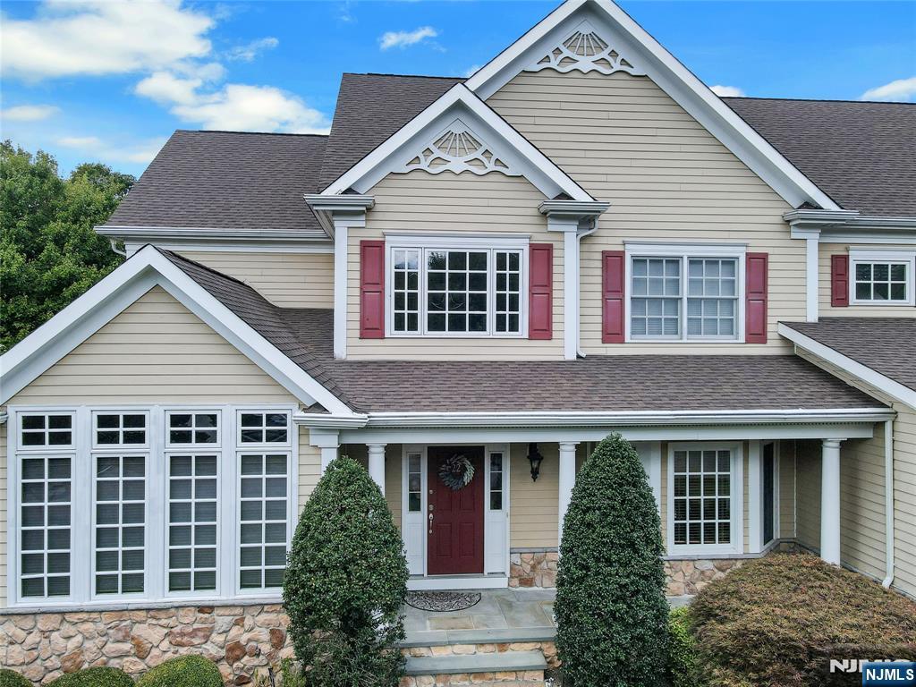 22 Meadowlake Drive Mahwah, NJ 07430 - Photo 36 of 39 front view of a house with a yard