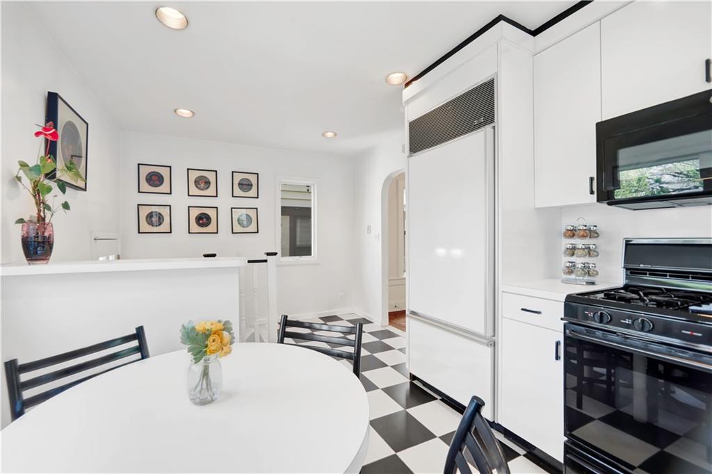 188 79th Street Brooklyn, NY 11209 - Photo 16 of 30 a kitchen with stainless steel appliances a refrigerator a stove a microwave and cabinets