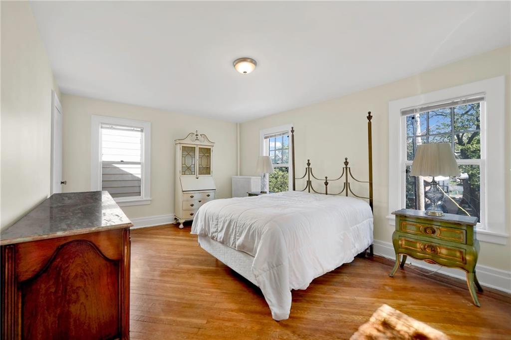 188 79th Street Brooklyn, NY 11209 - Photo 18 of 30 a spacious bedroom with a bed and wooden floor