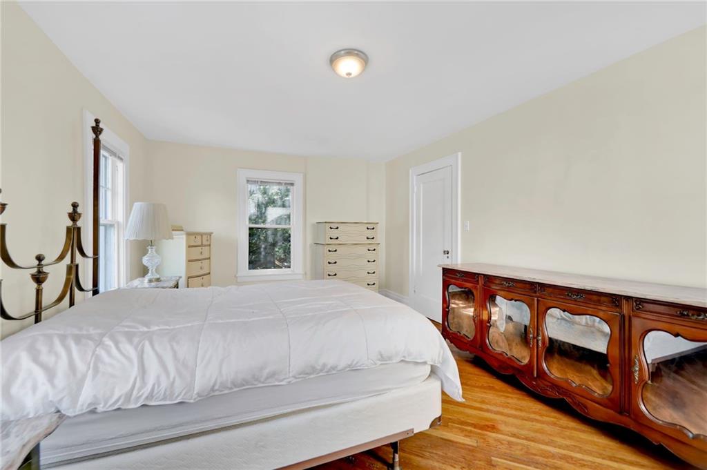 188 79th Street Brooklyn, NY 11209 - Photo 19 of 30 a bedroom with a bed and wooden floor