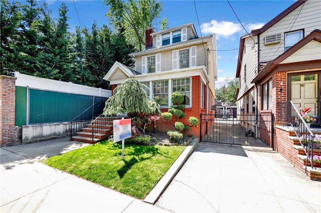 188 79th Street Brooklyn, NY 11209 - Photo 3 of 30 a front view of a house with a yard table and chairs