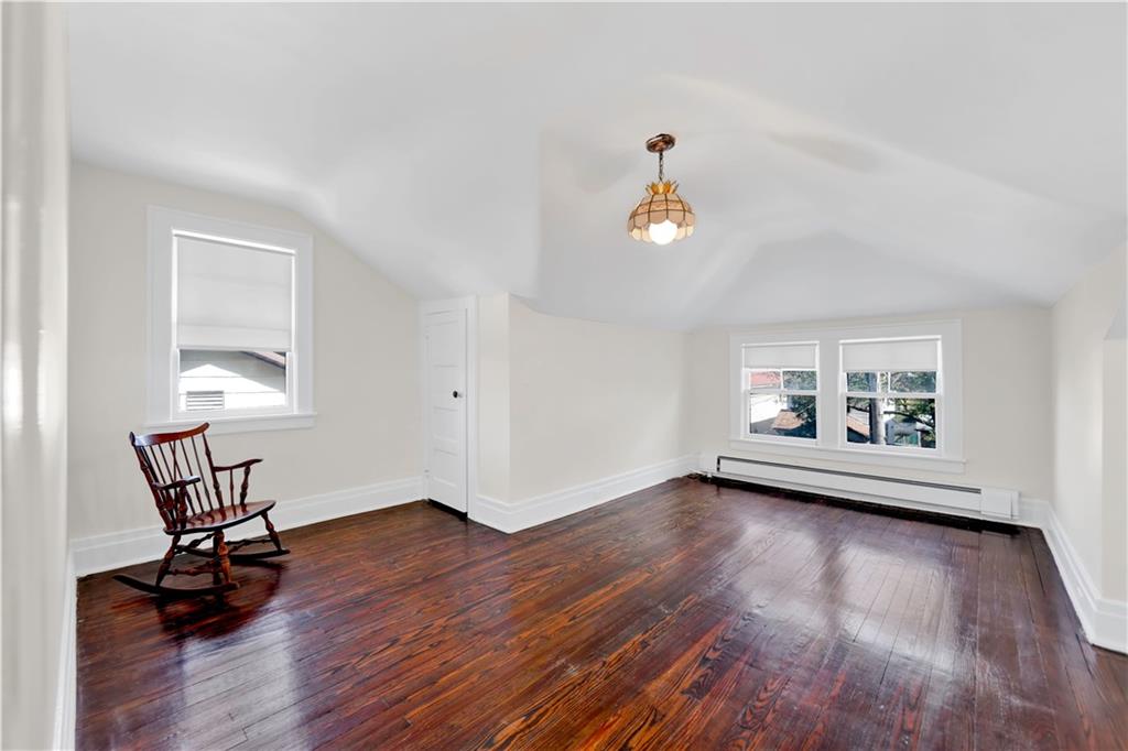 188 79th Street Brooklyn, NY 11209 - Photo 21 of 30 a view of empty room with wooden floor and fan