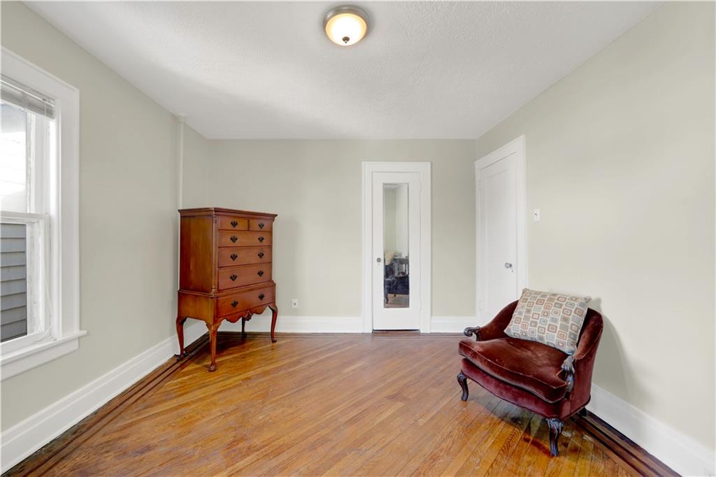 188 79th Street Brooklyn, NY 11209 - Photo 26 of 30 a living room with a couch and a window