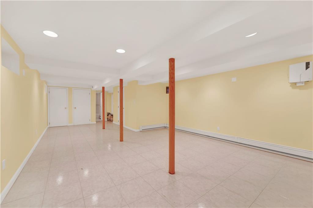 188 79th Street Brooklyn, NY 11209 - Photo 28 of 30 a view of an empty room with a ceiling fan
