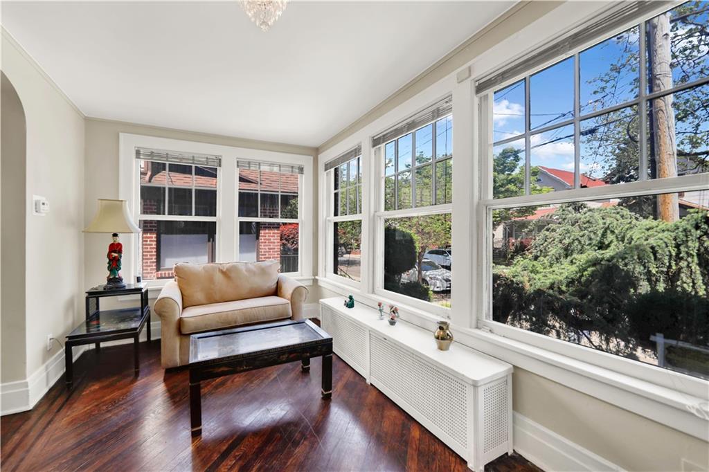188 79th Street Brooklyn, NY 11209 - Photo 4 of 30 a living room with furniture and a large window