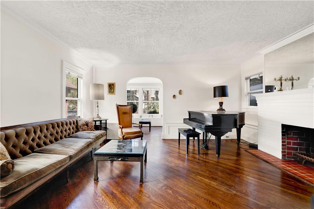 188 79th Street Brooklyn, NY 11209 - Photo 5 of 30 a living room with furniture and a fireplace