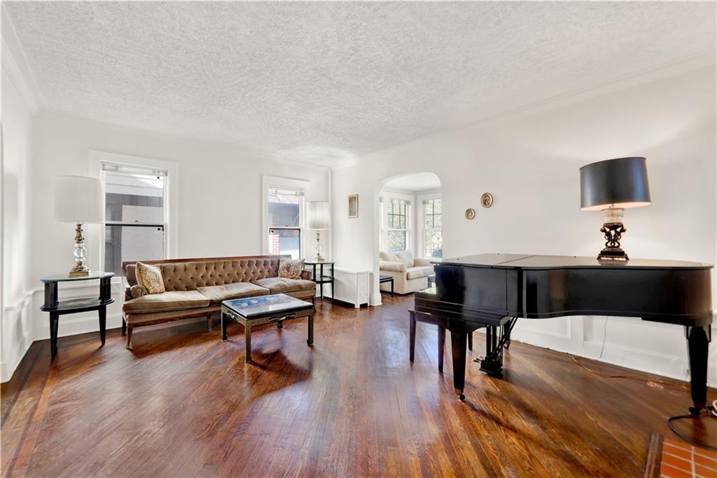188 79th Street Brooklyn, NY 11209 - Photo 7 of 30 a living room with furniture and a wooden floor