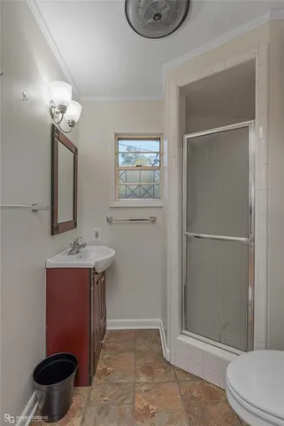 a bathroom with a toilet and a sink