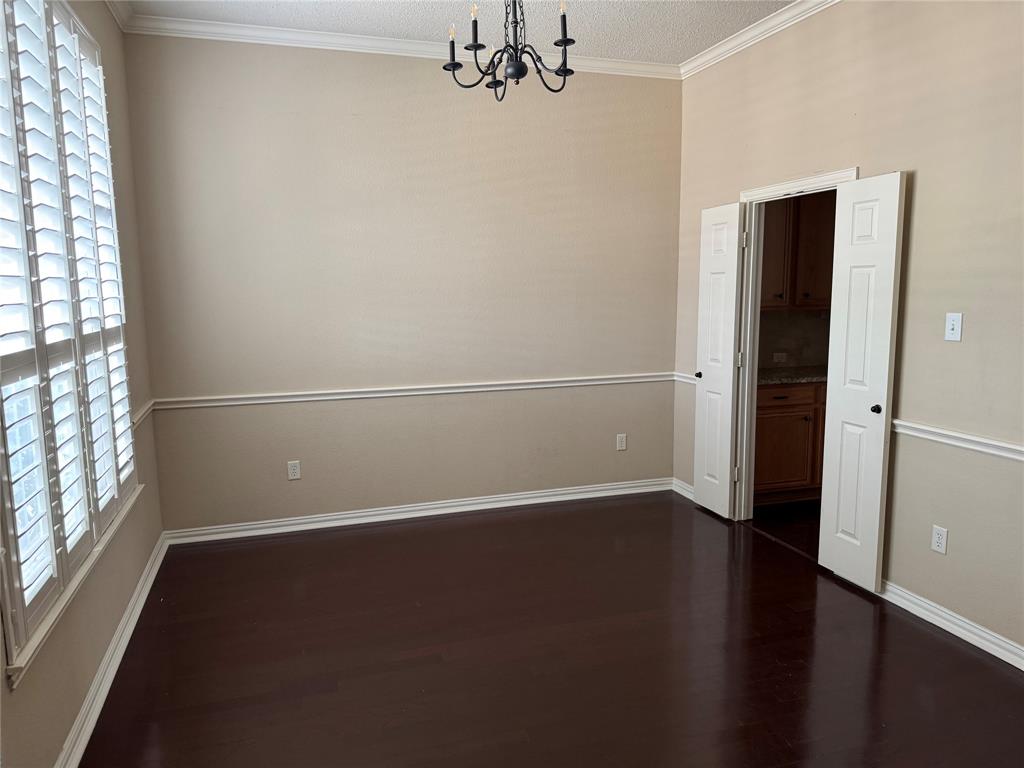 8272 Beartooth Drive Frisco, TX 75036 - Photo 2 of 16 an empty room with wooden floor windows and entrance