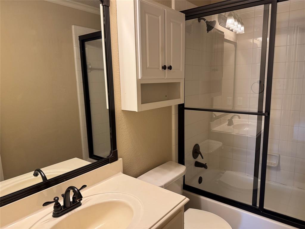 8272 Beartooth Drive Frisco, TX 75036 - Photo 5 of 16 a bathroom with a sink and a mirror