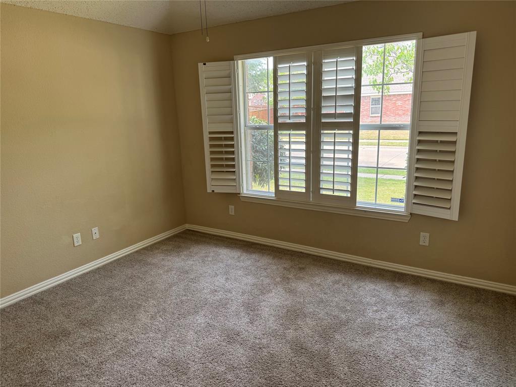8272 Beartooth Drive Frisco, TX 75036 - Photo 7 of 16 a view of an empty room with a window