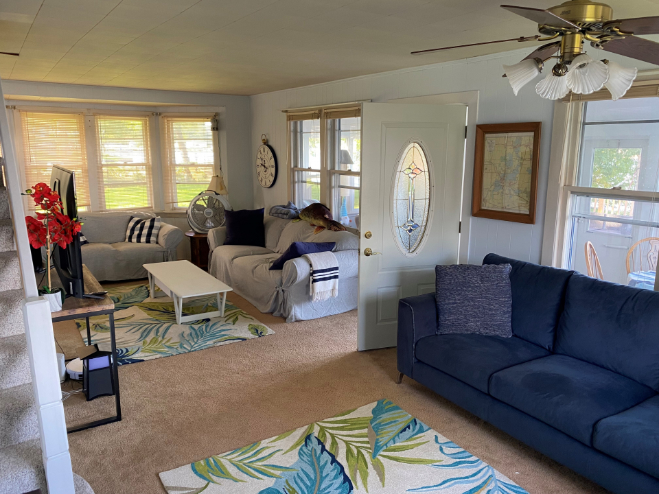 42434 North Witt Road Antioch, IL 60002 - Photo 3 of 15 a living room with furniture a fireplace and a chandelier
