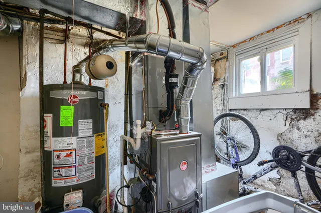a view of storage and utility room with two washing machine