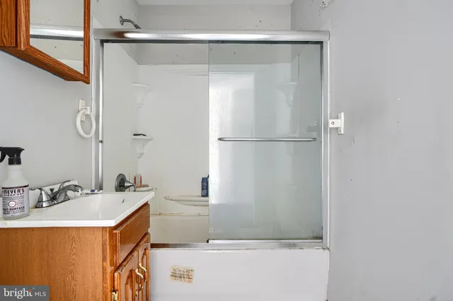 a bathroom with a sink and mirror