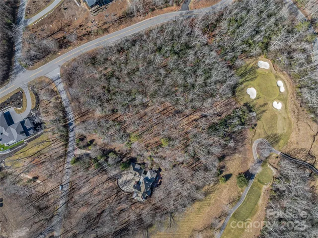 a view of a lake in middle of a forest