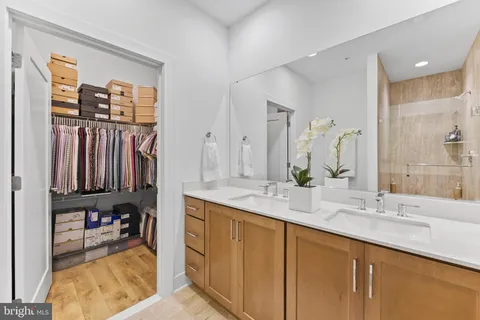 a bedroom with a bed and large window